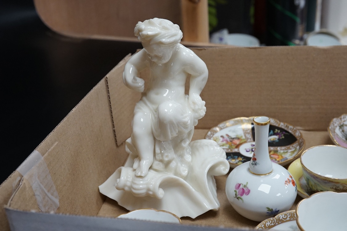 A group of 19th/20th century German porcelain, comprising a Nymphenburg pug, seven Dresden miniature cups and saucers and a Meissen bottle, largest 13cm high